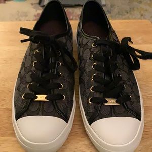 Cute coach sneakers with minor wear and tear.